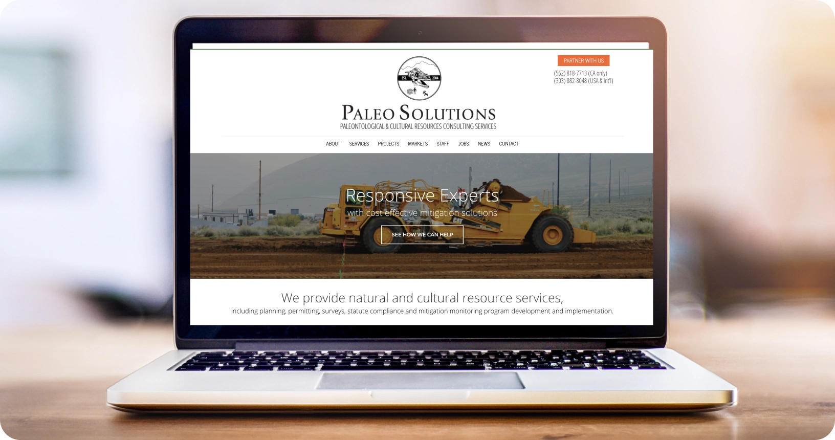 Photo of a laptop displaying the Paleo Solutions website